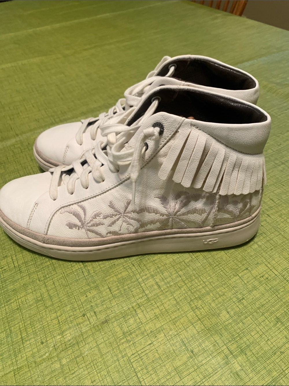 UGG White Fringe High-Top Sneaker with Subtle Embroidered Detail
